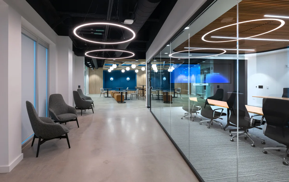 Conference room with feature ceiling and yellow accent door